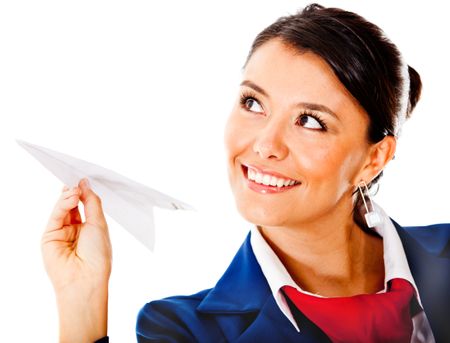 Air hostess holding a paper airplane - isolated over a white background