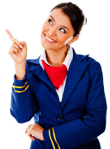 Beautiful flight attendant pointing with her finger - isolated over a white background