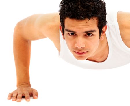casual man doing push ups isolated over a white background