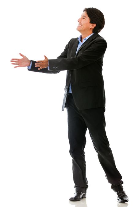 Businessman passing an imaginary object - isolated over a white background